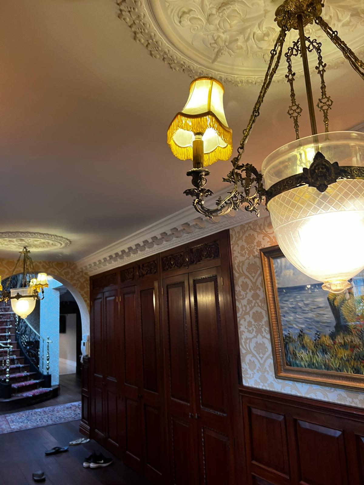 Grand hallway with chandelier in a premium UK property