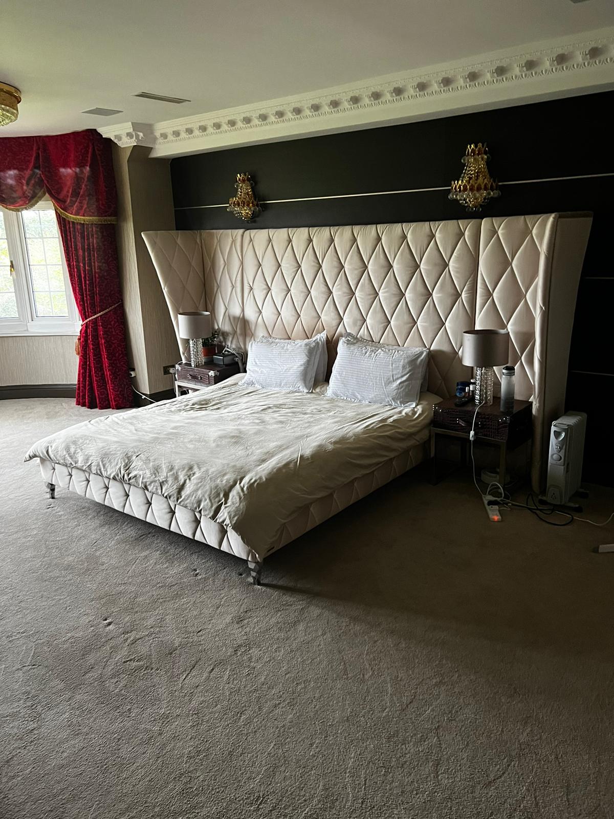 Walk-in dressing room with bespoke wardrobes and central island