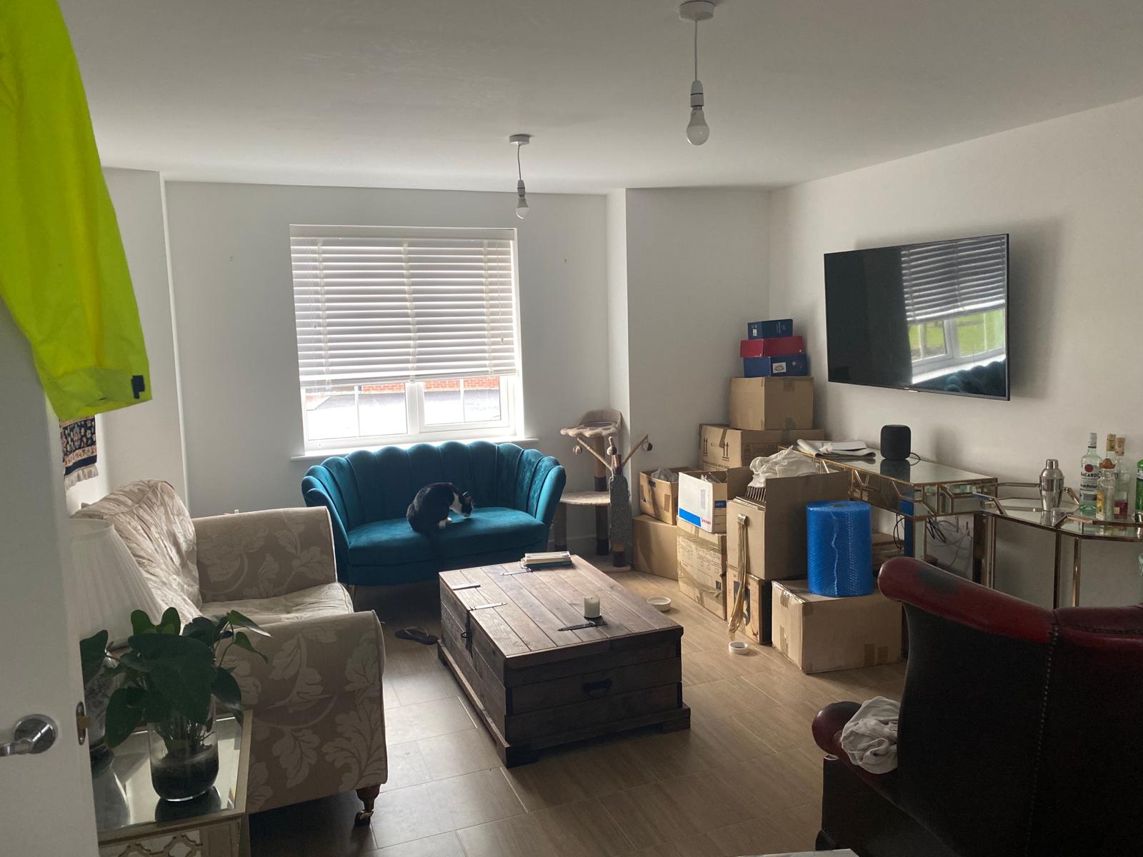 UK apartment on moving day with packed boxes ready to unpack