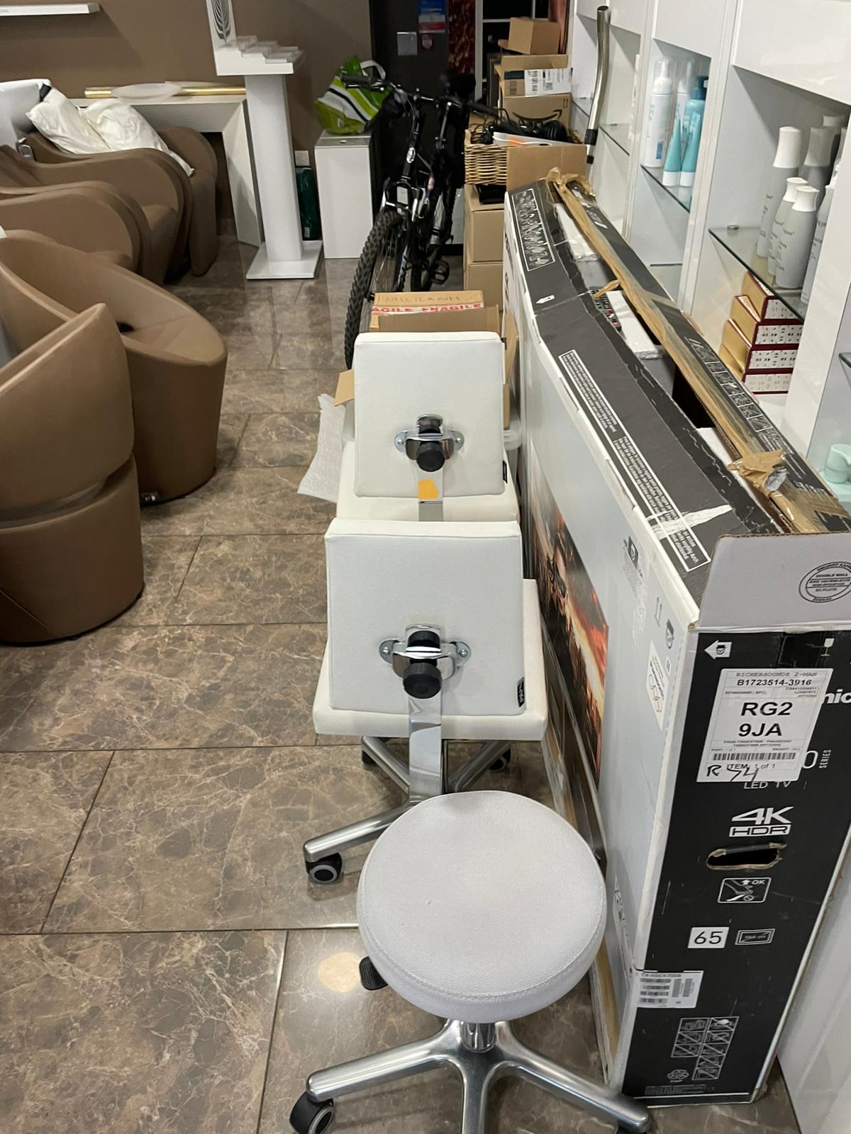 Salon and household items boxed and ready for a commercial move